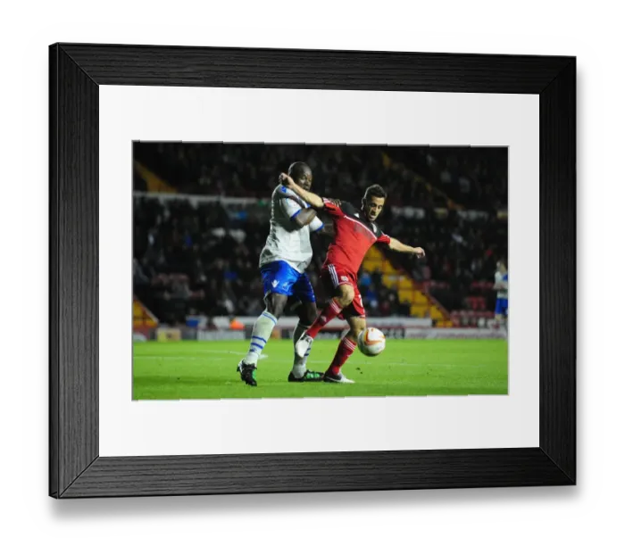 Framed Print : Bristol City's Sam Baldock vs Millwall's Danny Shittu: A Battle for Ball Possession in the Championship, October 2012 Framed Print : Bristol City's Sam Baldock vs Millwall's Danny Shittu: A Battle for Ball Possession in the Championship, October 2012