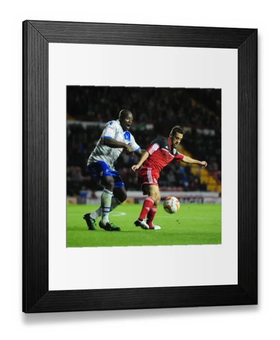 Framed Print : Bristol City vs Millwall Championship Showdown: Sam Baldock vs Danny Shittu's Intense Battle at Ashton Gate Stadium, October 2012