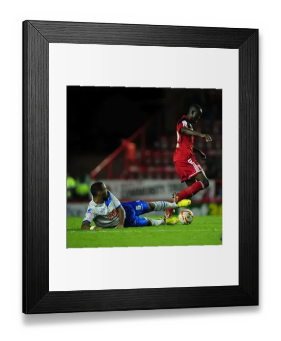 Framed Print : Adomah vs Trotter: Intense Battle in Bristol City vs Millwall Football Match, Championship 2012 Framed Print : Adomah vs Trotter: Intense Battle in Bristol City vs Millwall Football Match, Championship 2012