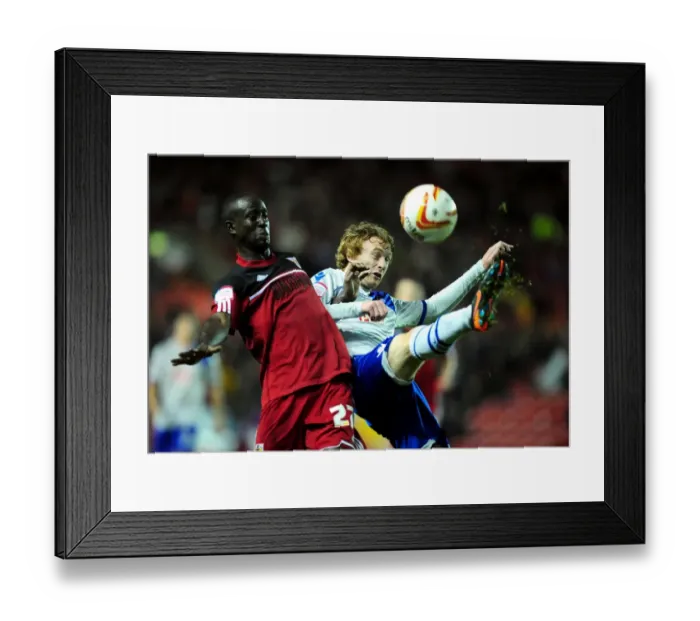 Framed Print : Bristol City vs Millwall: Albert Adomah vs Chris Taylor Battle for High Ball in Championship Match