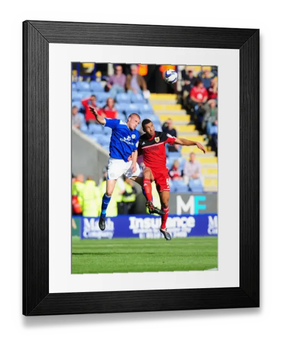 Framed Print : Battling for Supremacy: Lewin Nyatanga vs. Jamie Vardy in Leicester City vs. Bristol City Championship Clash Framed Print : Battling for Supremacy: Lewin Nyatanga vs. Jamie Vardy in Leicester City vs. Bristol City Championship Clash