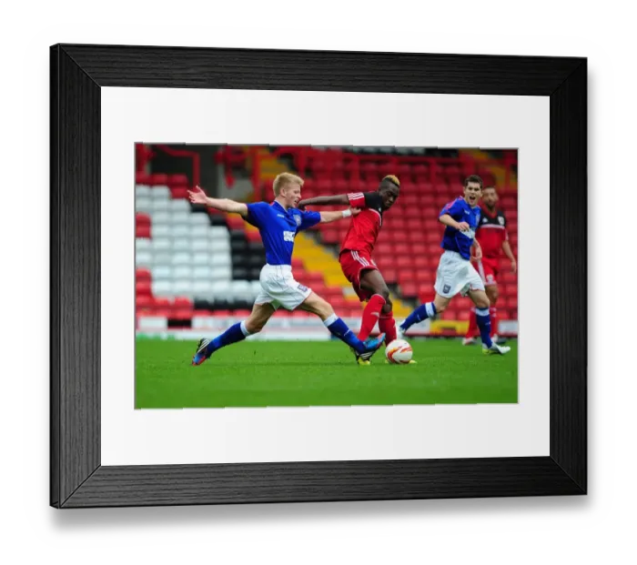 Framed Print : Ridwan Oluwatobi's Determined Battle for Possession: Bristol City U21s vs Ipswich Town U21s