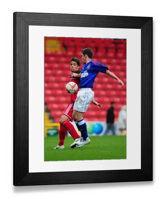 Framed Print : Bristol City's Curtis Jones Tackles Ipswich Town's Bryan Lawrence in Intense U21s Clash
