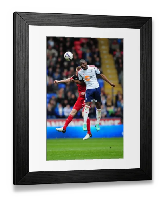 Framed Print : Battling for Supremacy: Afobe vs. Pearson in the 2010-11 Championship Clash between Bolton Wanderers and Bristol City