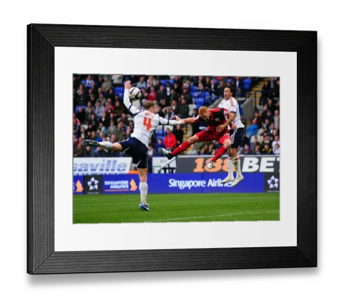 Framed Print : Ryan Taylor's Header at Reebok Stadium: A Pivotal Moment in the 2010-11 Championship Match Between Bolton Wanderers and Bristol City