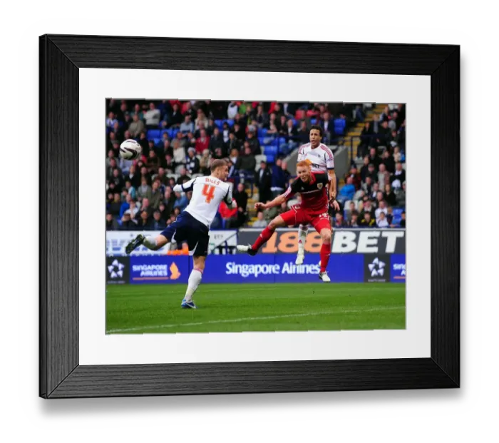 Framed Print : Ryan Taylor's Header: A Pivotal Moment in the 2010-11 Championship Clash Between Bolton Wanderers and Bristol City