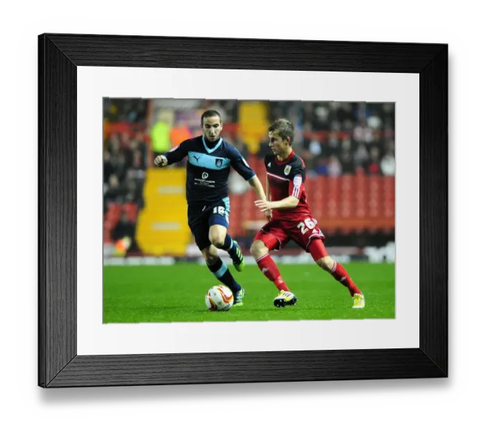 Framed Print : Bristol City vs Burnley: Joe Bryan Faces Martin Paterson Challenge in Championship Clash