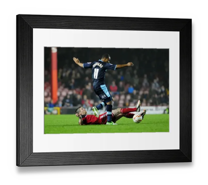 Framed Print : Bristol City vs Burnley: Mark Wilson Tackles Junior Stanislas in Championship Clash
