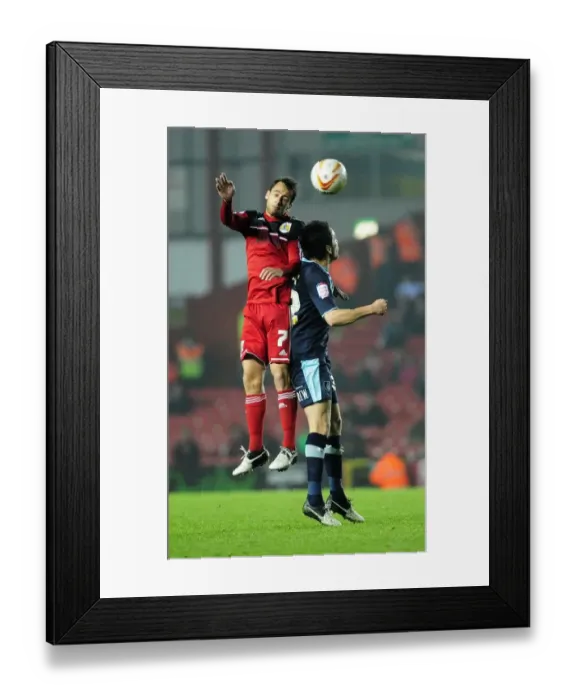 Framed Print : Bristol City's Sam Baldock Outjumps Burnley's Brian Stock for a Header in Championship Match Framed Print : Bristol City's Sam Baldock Outjumps Burnley's Brian Stock for a Header in Championship Match
