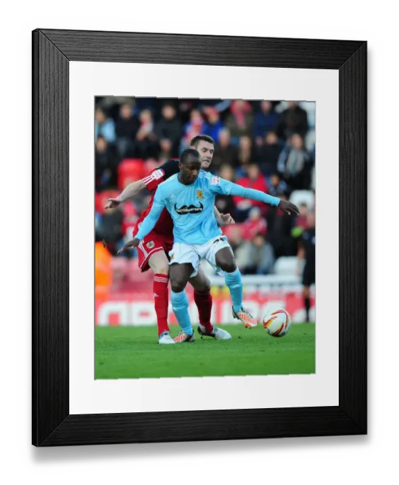 Framed Print : Battling for Supremacy: McManus vs. Aluko in the Championship Clash between Bristol City and Hull City