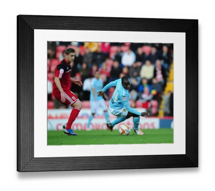 Framed Print : Battling for Supremacy: Davies vs. Aluko in the Championship Clash between Bristol City and Hull City Framed Print : Battling for Supremacy: Davies vs. Aluko in the Championship Clash between Bristol City and Hull City