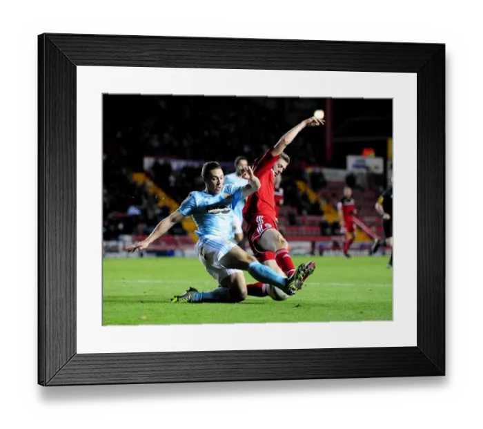 Framed Print : Bristol City vs Hull City: Jon Stead vs James Chester Battle in Championship Football Match