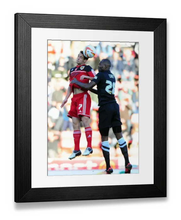 Framed Print : Aerial Clash: Sam Baldock vs Leon Cort - Championship Showdown at Ashton Gate Framed Print : Aerial Clash: Sam Baldock vs Leon Cort - Championship Showdown at Ashton Gate