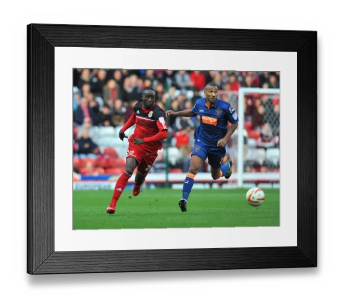 Framed Print : Adomah Outmaneuvers Grandin: Intense Moment from Bristol City vs. Blackpool Championship Match, 17th November 2012 Framed Print : Adomah Outmaneuvers Grandin: Intense Moment from Bristol City vs. Blackpool Championship Match, 17th November 2012