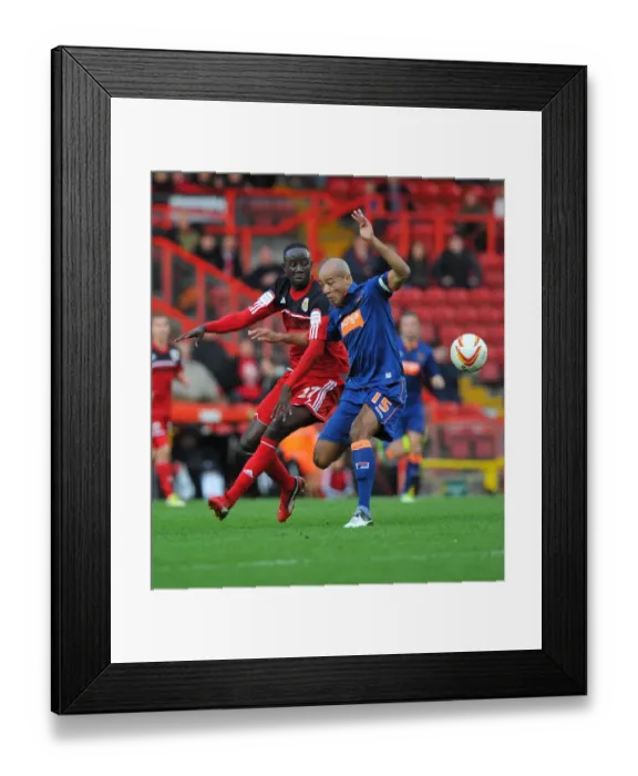 Framed Print : Adomah vs John-Baptiste: Intense Battle in Bristol City vs Blackpool Championship Match, 17 / 11 / 2012 Framed Print : Adomah vs John-Baptiste: Intense Battle in Bristol City vs Blackpool Championship Match, 17 / 11 / 2012