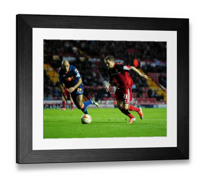Framed Print : Bristol City's Paul Anderson Outmaneuvers Blackpool's Alex John-Baptiste in Championship Clash