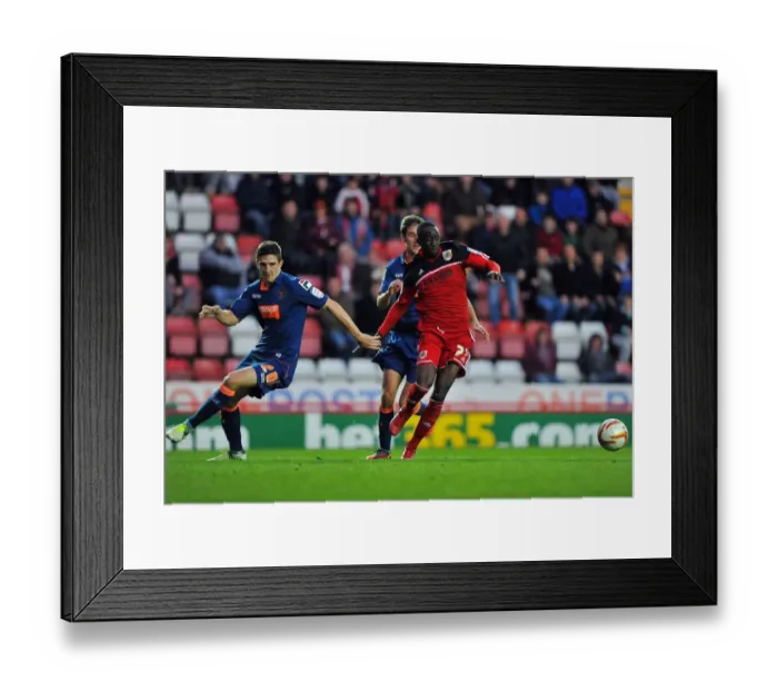 Framed Print : Bristol City vs Blackpool: Albert Adomah vs Craig Cathcart Battle for Ball in Championship Match