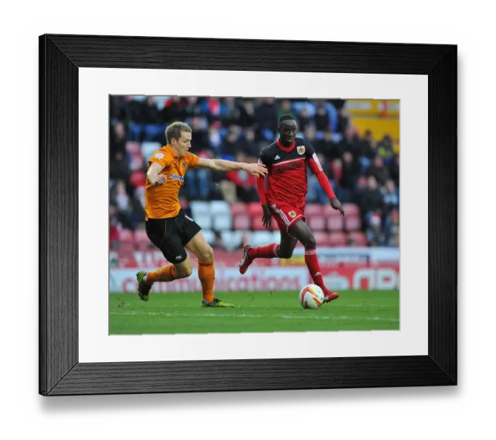Framed Print : Bristol City vs. Wolverhampton Wanderers: Albert Adomah vs. Christophe Berra Battle for Possession in Championship Match, December 2012 Framed Print : Bristol City vs. Wolverhampton Wanderers: Albert Adomah vs. Christophe Berra Battle for Possession in Championship Match, December 2012