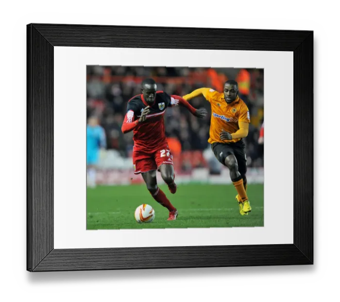 Framed Print : Adomah vs Ebanks-Blake: Intense Battle for Possession in Bristol City vs Wolves Championship Clash Framed Print : Adomah vs Ebanks-Blake: Intense Battle for Possession in Bristol City vs Wolves Championship Clash