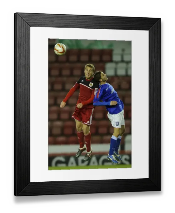 Framed Print : Intense Aerial Battle: Will Cline of Bristol City U18s vs Ipswich Town U18 Defender - FA Youth Cup Third Round, Ashton Gate Stadium Framed Print : Intense Aerial Battle: Will Cline of Bristol City U18s vs Ipswich Town U18 Defender - FA Youth Cup Third Round, Ashton Gate Stadium