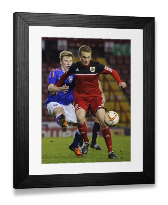 Framed Print : Intense Moment: Young Star Cline's Battle in FA Youth Cup Third Round Proper at Ashton Gate Stadium