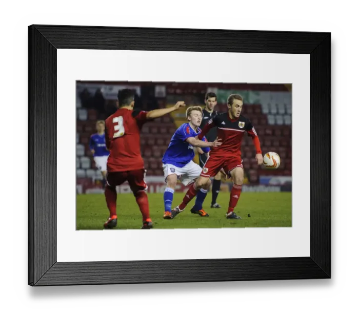 Framed Print : Young Stars Clash: Intense Football Action - FA Youth Cup Third Round Proper: Bristol City U18 vs Ipswich Town U18, December 2012