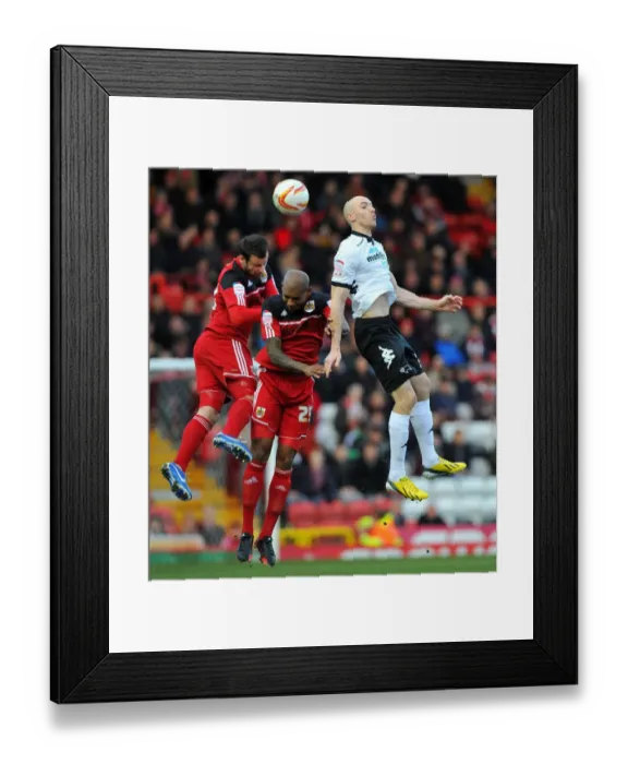 Framed Print : Derby County's Conor Sammon Leaps Above Bristol City's Marvin Elliott and Richard Foster Framed Print : Derby County's Conor Sammon Leaps Above Bristol City's Marvin Elliott and Richard Foster