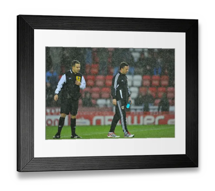 Framed Print : Bristol City vs. Watford: Derek McInnes Discusses with Referee Michael Naylor Before Game Postponement (December 2012)