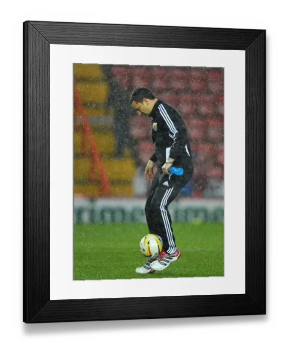 Framed Print : Derek McInnes Examines the Floodlit Pitch as Championship Match between Bristol City and Watford is Aborted (December 26, 2012) Framed Print : Derek McInnes Examines the Floodlit Pitch as Championship Match between Bristol City and Watford is Aborted (December 26, 2012)