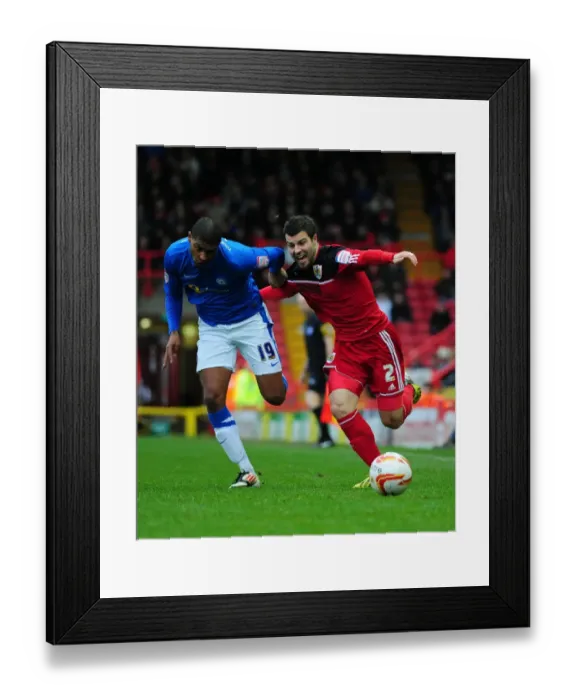 Framed Print : Battling Wings: Foster vs. Little in the Championship Clash between Bristol City and Peterborough