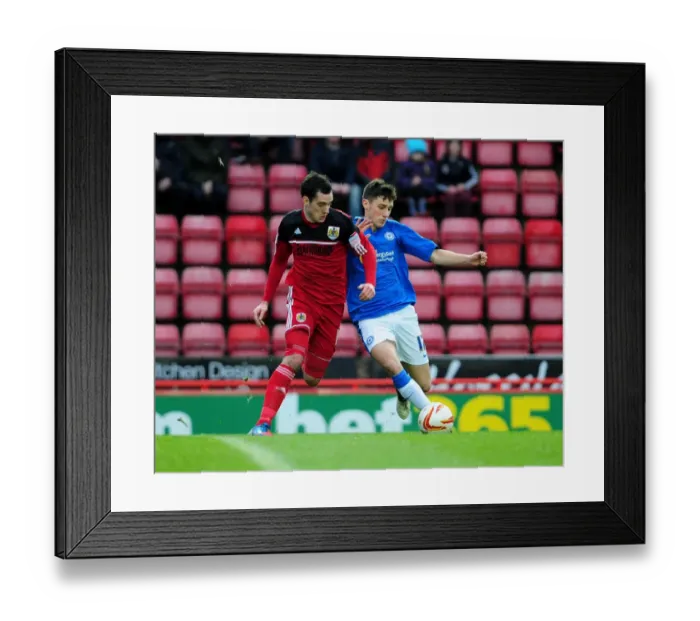 Framed Print : Battling for Possession: Gregg Cunningham vs. Joe Newell in Championship Clash between Bristol City and Peterborough United Framed Print : Battling for Possession: Gregg Cunningham vs. Joe Newell in Championship Clash between Bristol City and Peterborough United