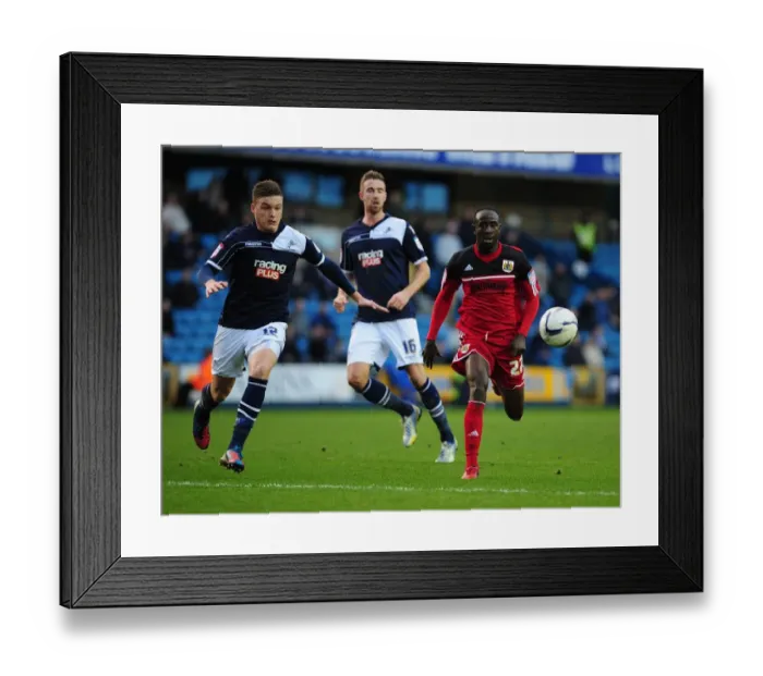 Framed Print : Chasing the Win: Albert Adomah Pursues Loose Ball in Intense Millwall vs. Bristol City Championship Match