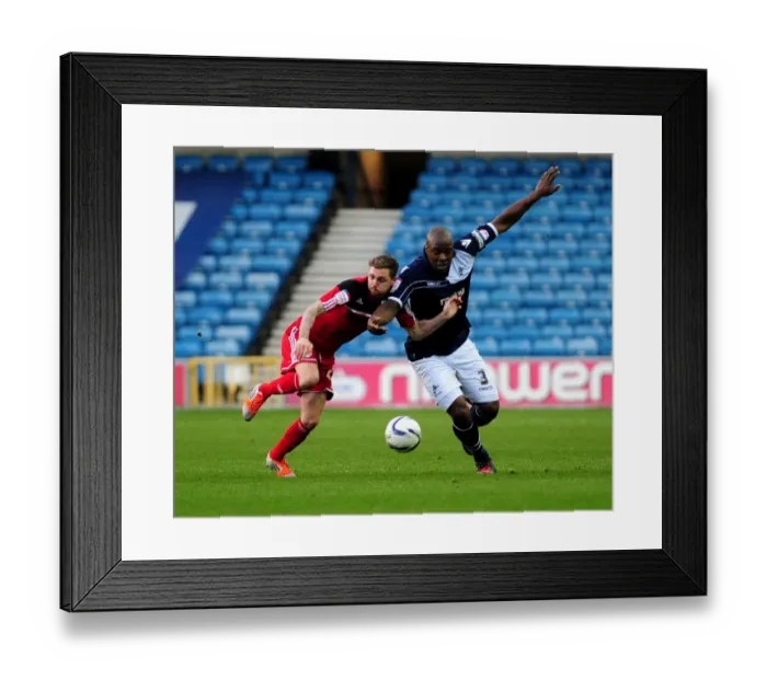 Framed Print : Battling for Possession: Paul Anderson vs. Danny Shittu in the Championship Clash between Millwall and Bristol City Framed Print : Battling for Possession: Paul Anderson vs. Danny Shittu in the Championship Clash between Millwall and Bristol City