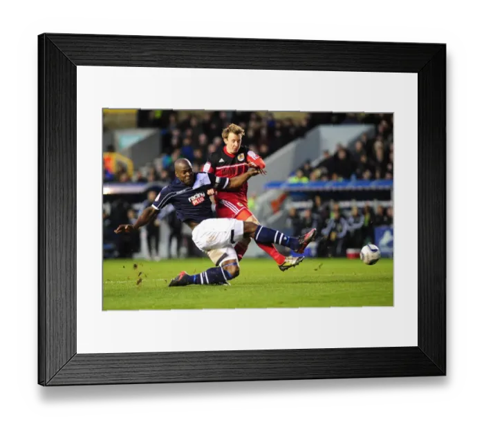 Framed Print : Clash at The Den: Martyn Woolford Thwarted by Danny Shittu