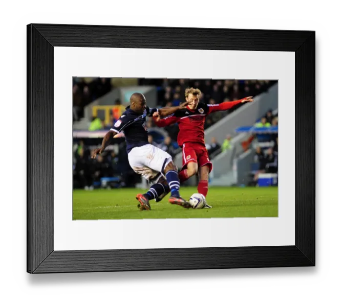 Framed Print : Championship Showdown: Intense Moment as Millwall's Danny Shittu Challenges Bristol City's Martyn Woolford in the Penalty Box Framed Print : Championship Showdown: Intense Moment as Millwall's Danny Shittu Challenges Bristol City's Martyn Woolford in the Penalty Box