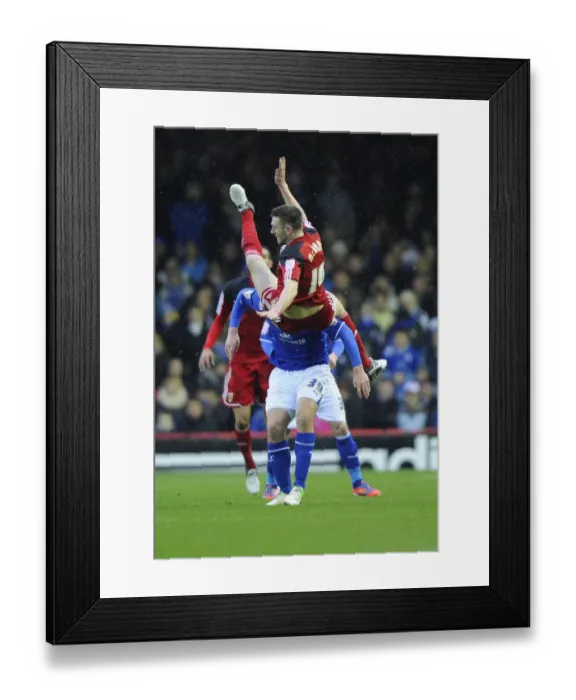 Framed Print : Bristol City vs Leicester City: Stephen McManus Takes a Tumble as Chris Wood Presses On