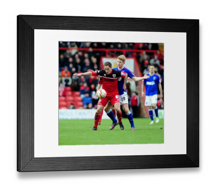 Framed Print : Bristol City vs Ipswich Town: Neil Kilkenny Secures Ball from Luke Hyam