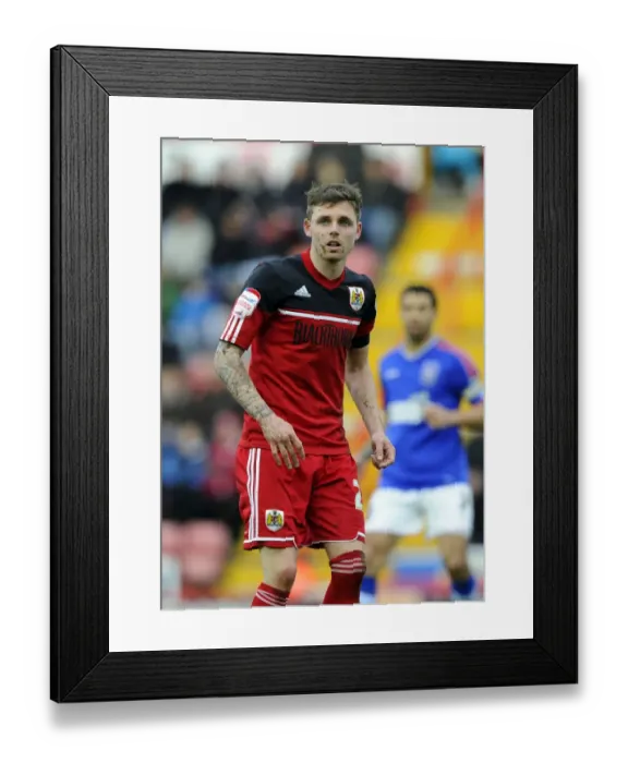 Framed Print : Bristol City's Paul Anderson Slides in Mud during Championship Match against Ipswich Town, January 2013 Framed Print : Bristol City's Paul Anderson Slides in Mud during Championship Match against Ipswich Town, January 2013