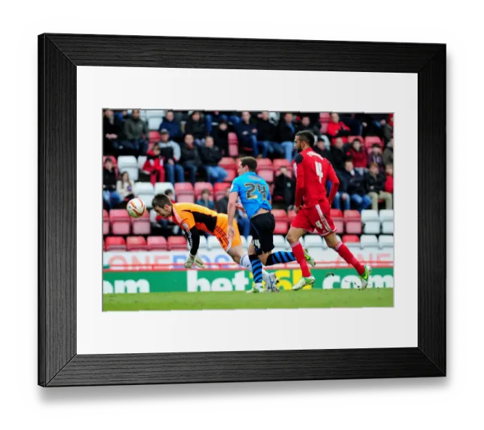 Framed Print : Bristol City's Tom Heaton Saves the Day: Heading Away from Danger Against Nottingham Forest Framed Print : Bristol City's Tom Heaton Saves the Day: Heading Away from Danger Against Nottingham Forest