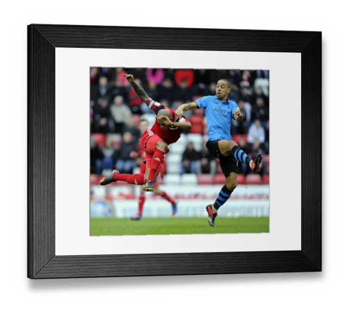Framed Print : Bristol City's Marvin Elliott Fouls by Dexter Blackstock during Championship Match Framed Print : Bristol City's Marvin Elliott Fouls by Dexter Blackstock during Championship Match