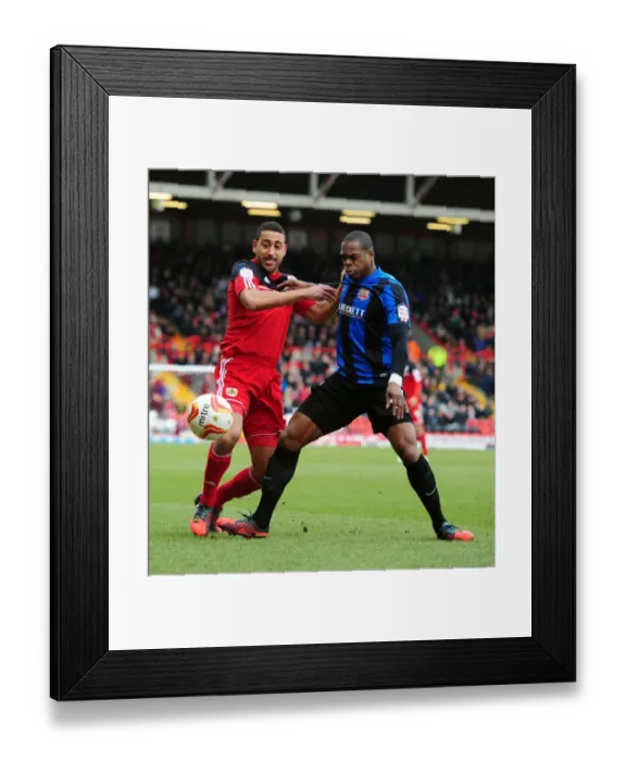 Framed Print : Intense Rivalry: Nyatanga vs Harewood - A Football Battle at Ashton Gate (Bristol City vs Barnsley) Framed Print : Intense Rivalry: Nyatanga vs Harewood - A Football Battle at Ashton Gate (Bristol City vs Barnsley)