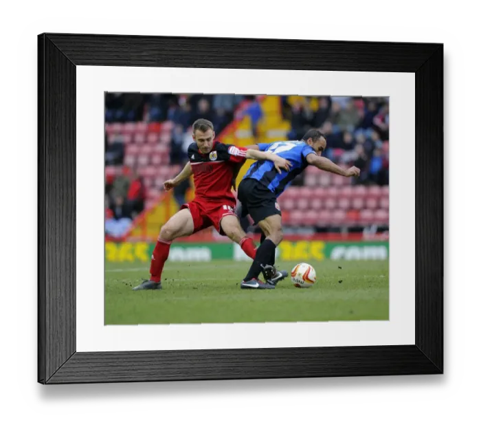 Framed Print : Intense Battle for Possession: Liam Kelly vs. Chris O'Grady - Npower Championship Clash