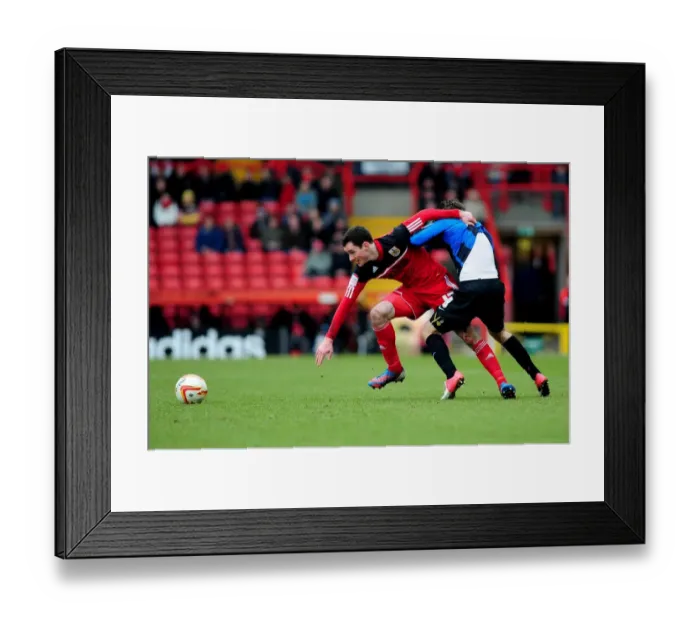Framed Print : Intense Rivalry: Cunningham vs. O'Brien's Battle for Ball Possession, Bristol City vs. Barnsley