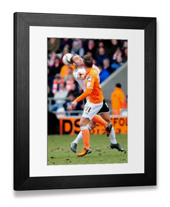 Framed Print : Bristol City vs Blackpool: Intense Aerial Battle Between Liam Kelly and Angel Framed Print : Bristol City vs Blackpool: Intense Aerial Battle Between Liam Kelly and Angel