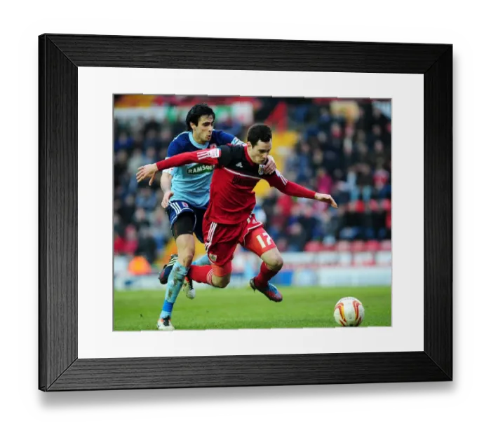 Framed Print : Bristol City's Gregg Cunningham Stops Rhys Williams: A Npower Championship Battle at Ashton Gate Framed Print : Bristol City's Gregg Cunningham Stops Rhys Williams: A Npower Championship Battle at Ashton Gate