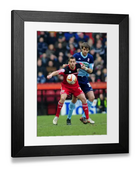 Framed Print : Bristol City's Sam Baldock Faces Off Against Middlesbrough's Jonathan Woodgate in Npower Championship Clash