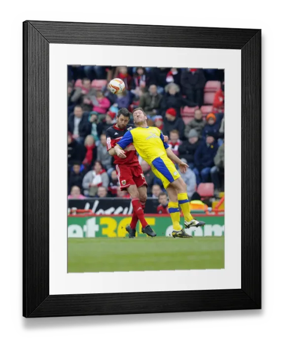 Framed Print : Intense Aerial Battle: Cole Skuse vs Steve Howard - Football Rivalry at Ashton Gate, 2013 Framed Print : Intense Aerial Battle: Cole Skuse vs Steve Howard - Football Rivalry at Ashton Gate, 2013