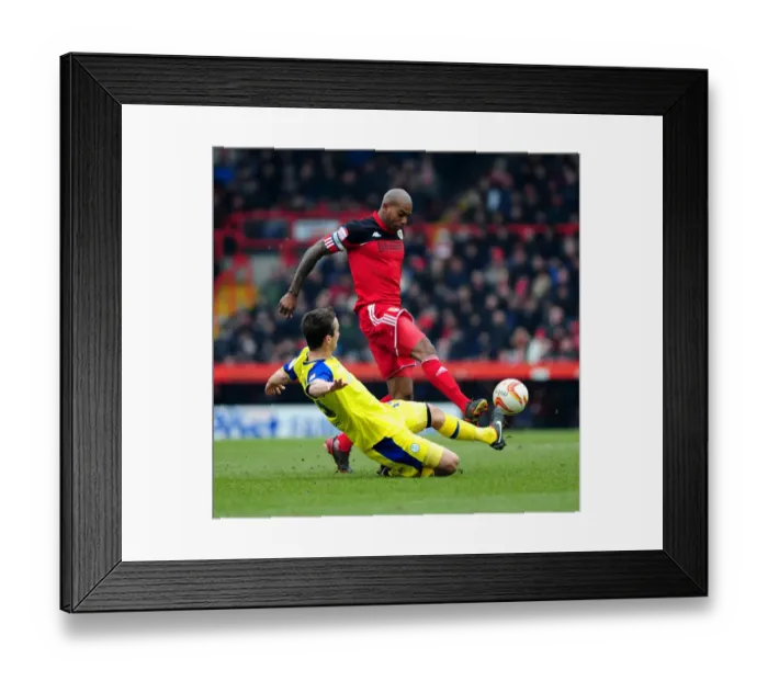 Framed Print : Clash at Ashton Gate: Marvin Elliott vs. Danny Pugh Tackle - Npower Championship, 2013