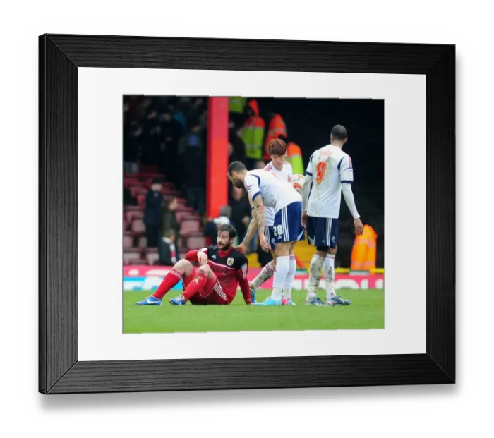 Framed Print : Bristol City's Matthew Bates Faces Off Against Bolton Players in Intense Npower Championship Clash Framed Print : Bristol City's Matthew Bates Faces Off Against Bolton Players in Intense Npower Championship Clash