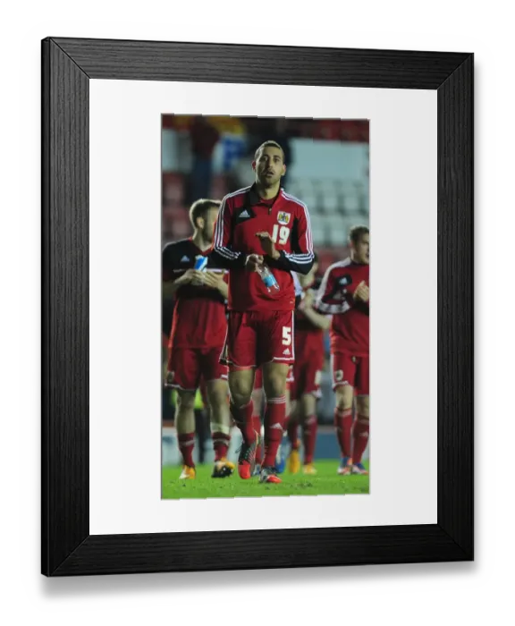 Framed Print : Bristol City's Heartbreaking Moment: Lewin Nyatanga Leaves the Field After Relegation against Birmingham City (16-04-2013)